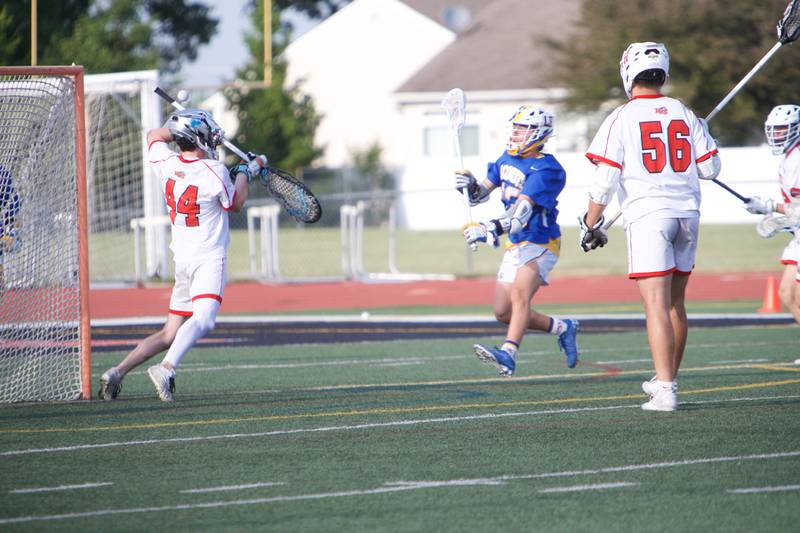 Huntley's Collin McDougal blocks a shot on goal by Lake Forest at the Super Sectional Final on Tuesday, May 30, 2023 in Huntley.