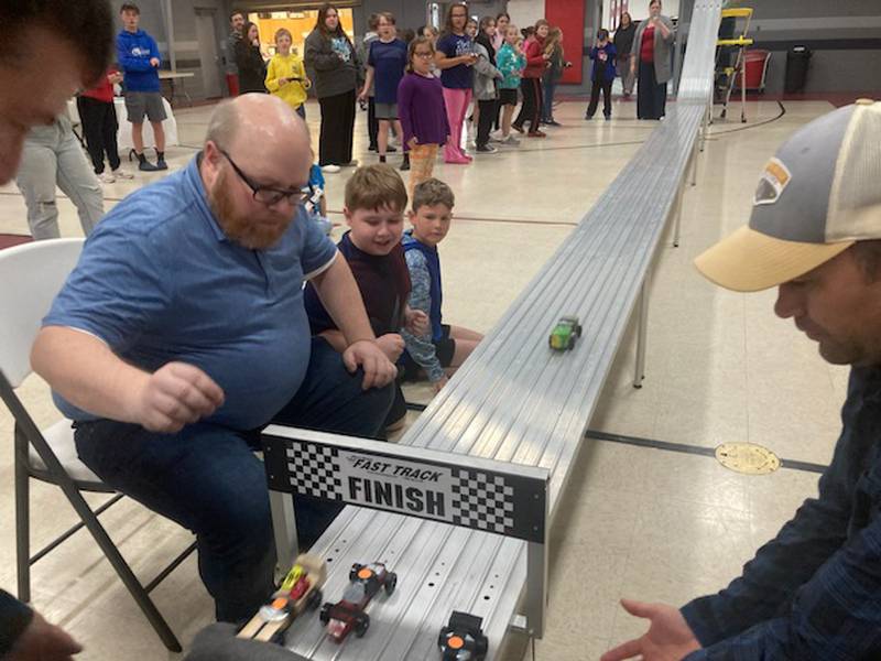 Matt. Eggers checks the finish line during the AWANA Pinewood Derby Night at Princeton Bible Church.