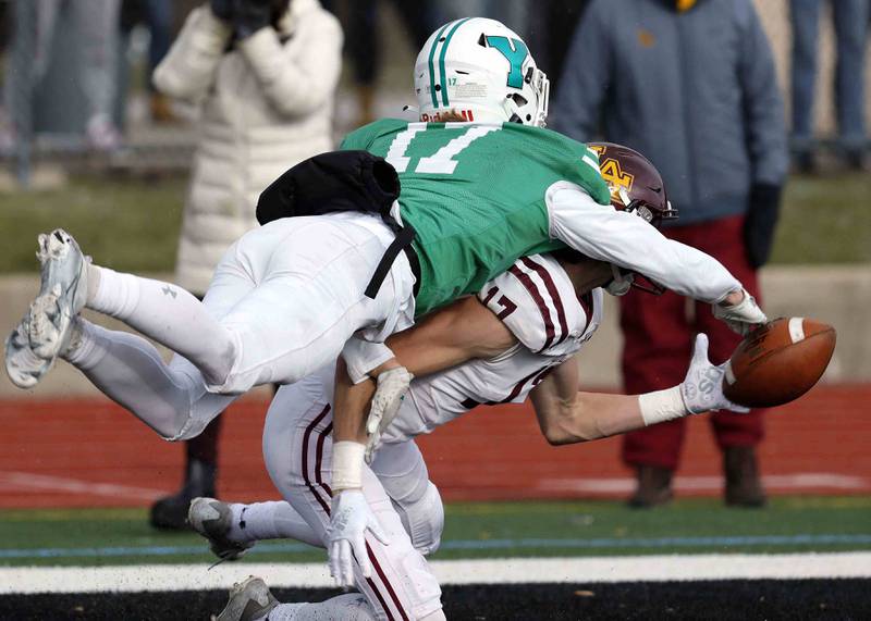 York’s Connor Dorner (17) denies a touchdown pass to Loyola's Declan Forde (17) during the IHSA Class 8A semifinal football game Saturday November 19, 2022 in Elmhurst.