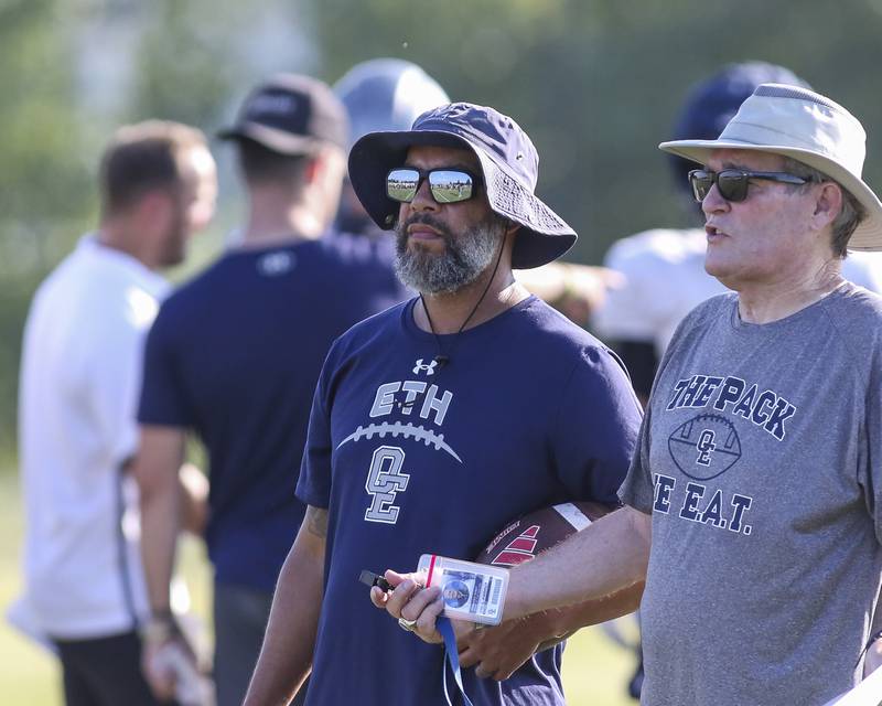 Head coach Tyson LeBlanc (L)  looks on at Oswego East High School football practice, Monday, Aug 13, 2025  in Oswego.