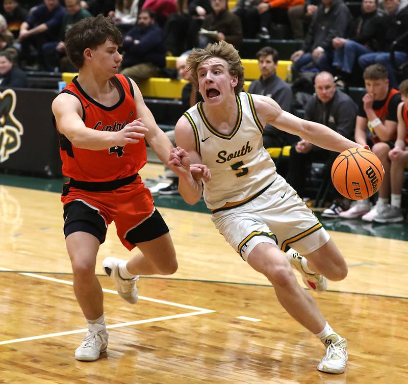 Crystal Lake South's Carson Trivellini (right) drives to the basket against Crystal Lake Central's Bud Shanahan during an IHSA Class 3A Crystal Lake South Regional boys basketball semifinal game on Wednesday, February, 25, 2026, at Crystal Lake South High School.