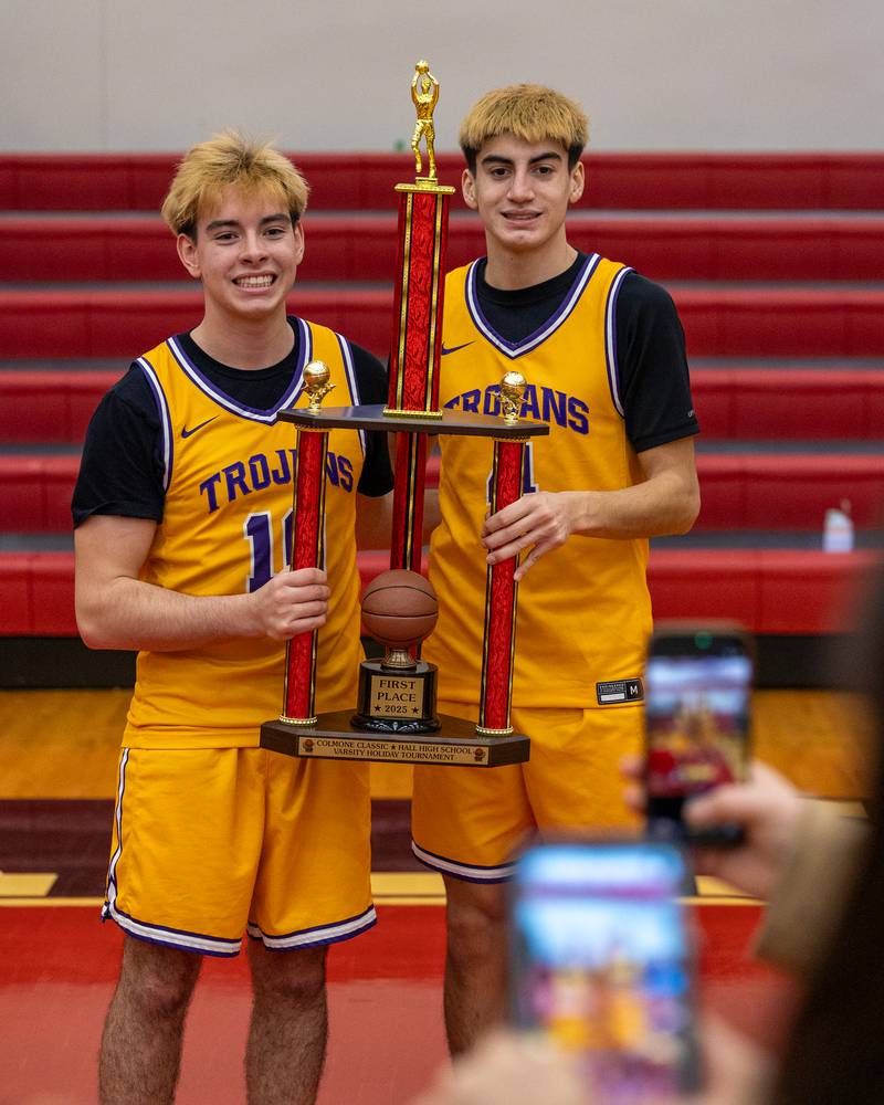 Mateo Goy (10) and teammate Johan Cortez (4) of Mendota pose for photos whilst holding the Colmone Classic Championship Trophy on Saturday, December 20, 2025 at Hall High School in Spring Valley.