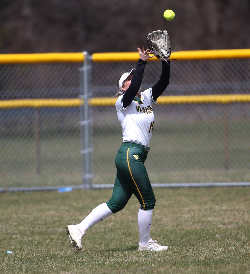 Waubonsie Valley’s Megan Kennedy grabs a fly ball in the outfield during a home game against Oswego East on Friday, April 1, 2022.