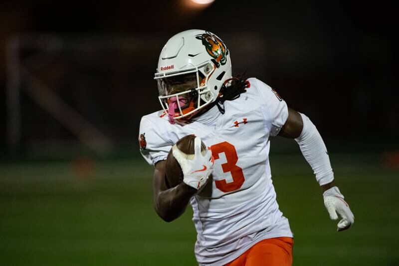 Plainfield East's Jeremiah Jenkins runs the ball during a game against Plainfield Central Friday Sept. 27, 2024 at Plainfield Central High School