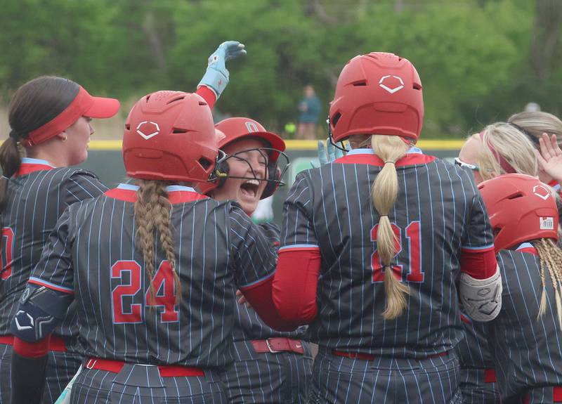Ottawa's Teagan Darif reacts with teammates at home plate after hitting her first home run against Seneca on Friday, May 1, 2026 at Seneca High School.