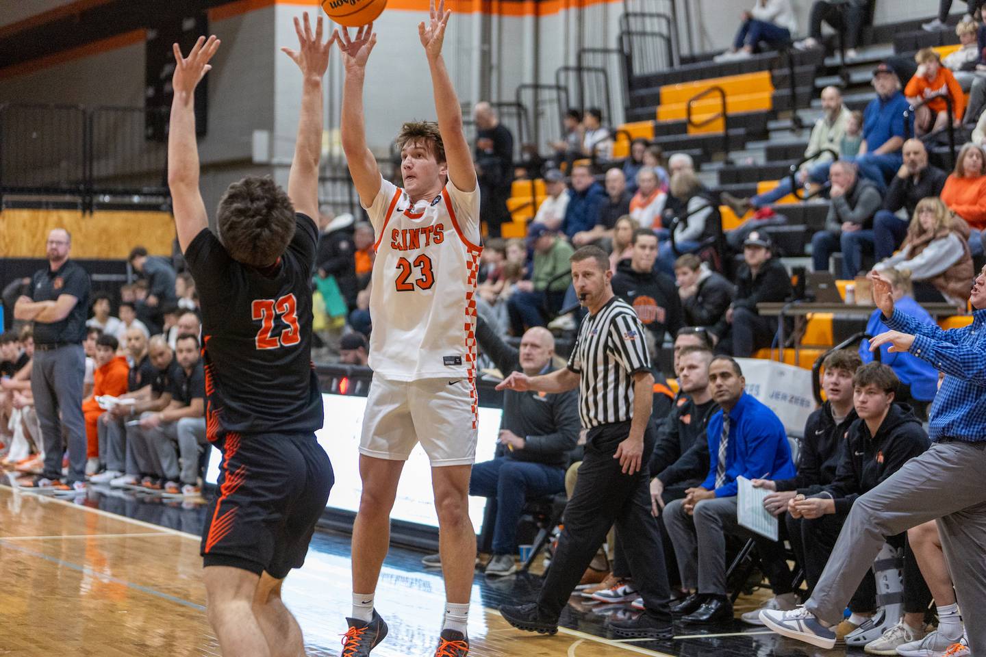 St. Charles East's Samuel Faidley shoots a jumper over Wheaton Warrenville South's David Showman on Friday, Dec. 5,2025 in ST. Charles.