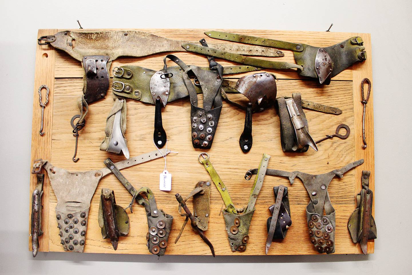 A pile of old corn shuckers was assembled by a consignor at The Reclamation Station in Savanna: It hangs on a board like abstract art sold as one piece.