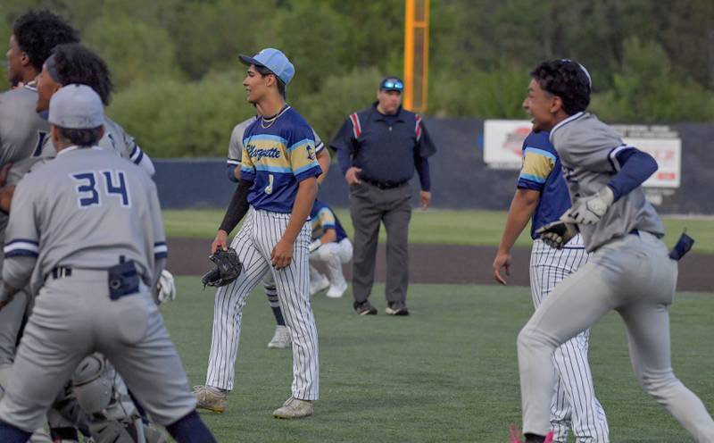 Marquette Academy's pitcher Taylor Waldron (3) reacts to the 3-2 loss as Chicago Hope Academy celebrates after 12 innings during the 1A baseball sectional semifinal at Judson University in Elgin on Thursday, May 25, 2023.