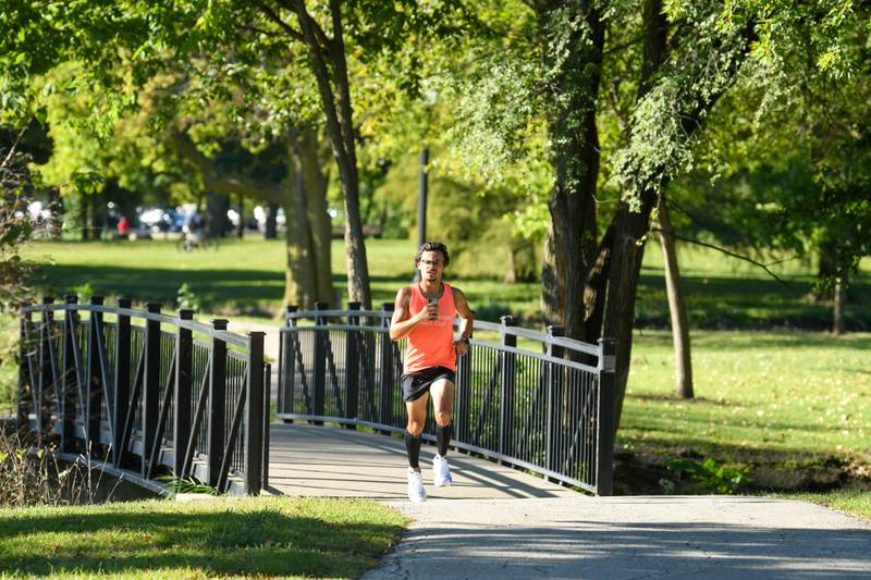 A runner goes through Northern Illinois University campus during the DeKalb Corn Classic 5K/10K run on Sunday, Sept. 29, 2024.