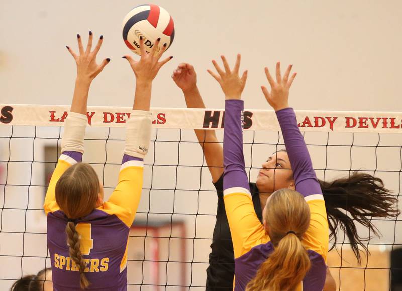 Hall's Natalia Zamora has her spike blocked by Mendota's Laylie Denault on Tuesday, Sept. 13, 2024 at Hall High School.