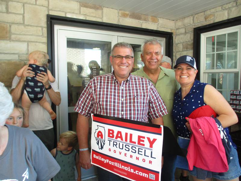 Oswego Township Supervisor Joe West, center, and Oswego Township Trustee Donna Sawicki, right, were eager to have a photo taken with Illinois gubernatorial candidate Darren Bailey during a campaign stop on June 16, 2022 in Oswego. West is a candidate for state representative and Sawicki is running for a seat on the Kendall County Board. (Mark Foster -- mfoster@shawmedia.com)