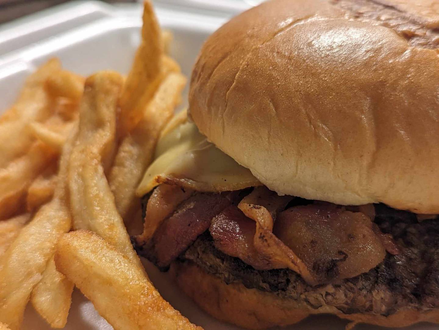 The backroad burger for $17 at Backroads Burger & Bar in Plainfield came with smoked gouda, pulled pork, applewood bacon, sautéed onions and house-made barbecue sauce.