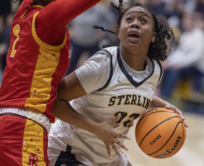 Sterling’s Joslyn Green works below the basket against Rock Island Tuesday, Nov. 25, 2025.