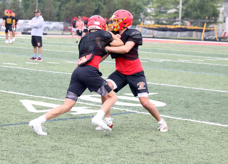 Batavia’s Josh Kahley (right) runs a drill with the team during practice at the school on Thursday, Aug. 10, 2023.