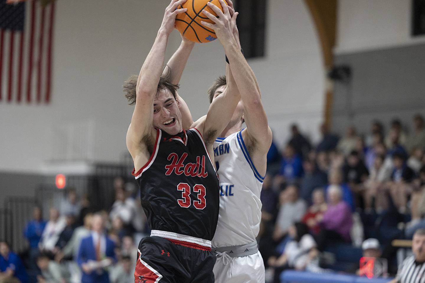 Hall’s Braden Curran and Newman’s Asher Ernst fight for a rebound Tuesday, Feb. 17, 2026.