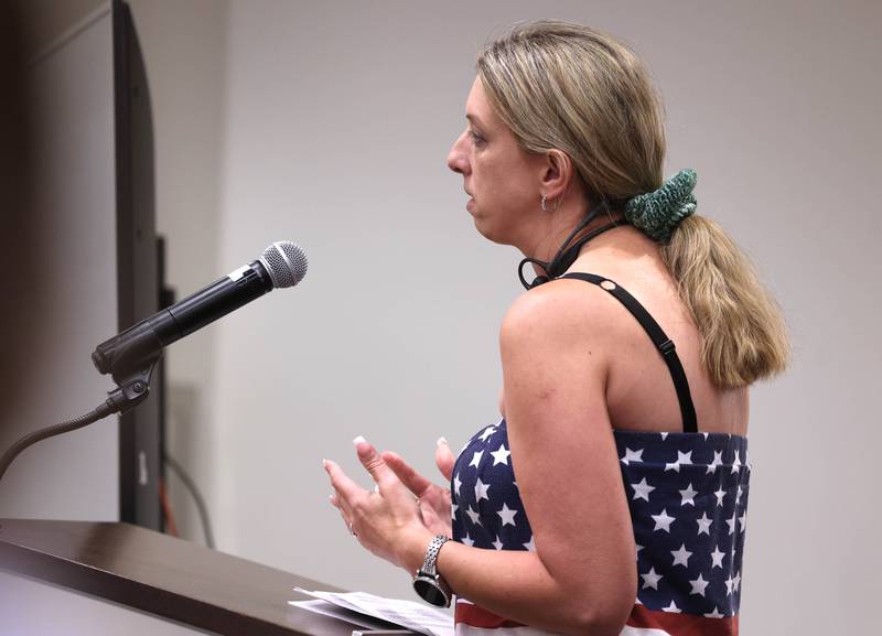 A public commenter talks Monday, June 23, 2025, about why she thinks the city should pass an ordinance prohibiting the sale of smoking products from vending machines during the city council meeting at the DeKalb Public Library.