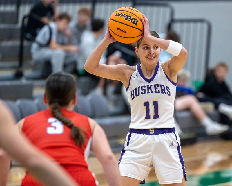Sage Mahler (11) of Serena holds basketball above head whilst looking for pass on Monday, November 17, 2025 at Seneca High School in Seneca.