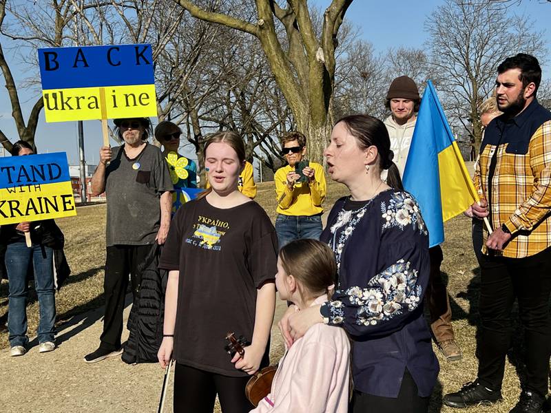 Anastassia Pankiv sings a Ukrainian song with other Ukrainian families during a Dixon vigil in support of Ukraine on March 13, 2025.