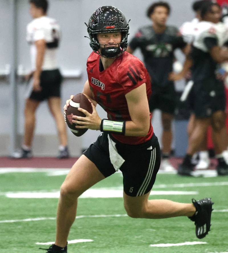 Northern Illinois University quarterback Josh Holst rolls out of the pocket Wednesday, July 31, 2024, during practice in the Chessick Practice Center at NIU.