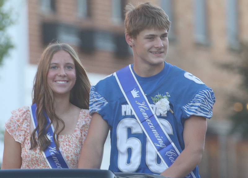 Freshman junior court attendants Ava Kyle and Jack Heaton ride during the Princeton High School homecoming parade on Thursday, Sept. 25, 2025 along South Main Street in Princeton .