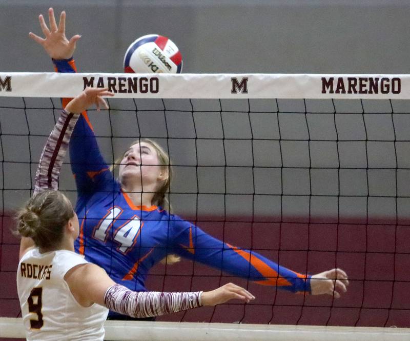 Genoa-Kingston’s Keiragan Gleissner, back, battles Richmond-Burton’s Reagan Wisniewski at the net in IHSA Class 2A Regional Title Game volleyball action on Thursday, Oct. 31, 2024, at  Marengo High School  in Marengo.