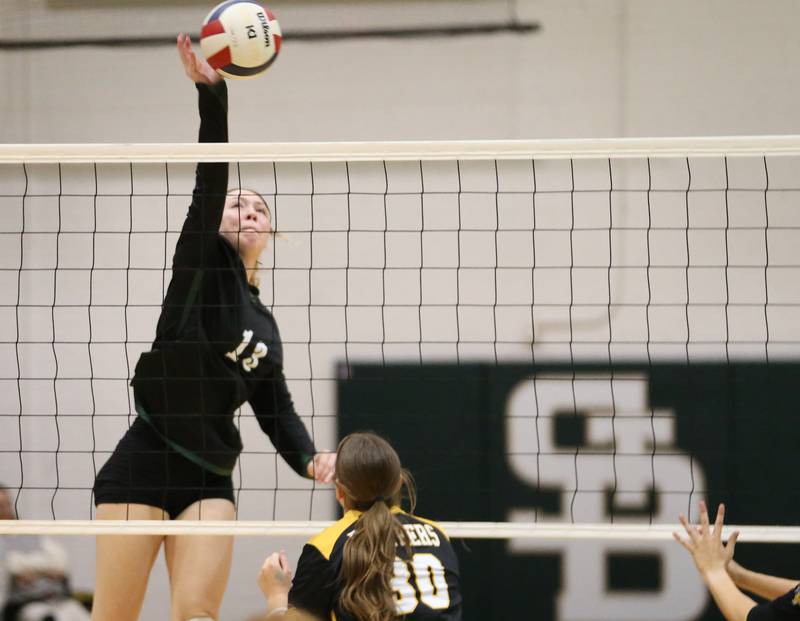 St. Bede's Ashlyn Ehm sends a kill past Putnam County's Myah Richardson on Tuesday, Sept. 24, 2024 at St. Bede Academy.