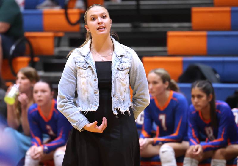 New Genoa-Kingston head volleyball coach Taylor Spellman talks to her team during their game against DeKalb Wednesday, Sept. 11, 2024, at Genoa-Kingston High School.