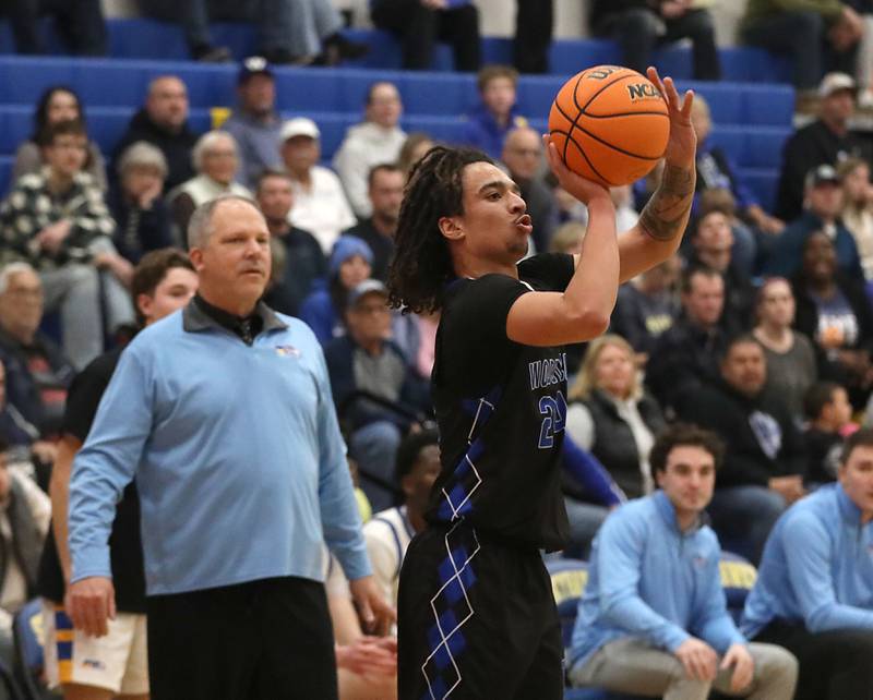 Woodstock's JJ Stokes shoots a three-pointer during a Kishwaukee River Conference boys basketball game against Johnsburg on Friday, February. 13, 2026, at Johnsburg High School.