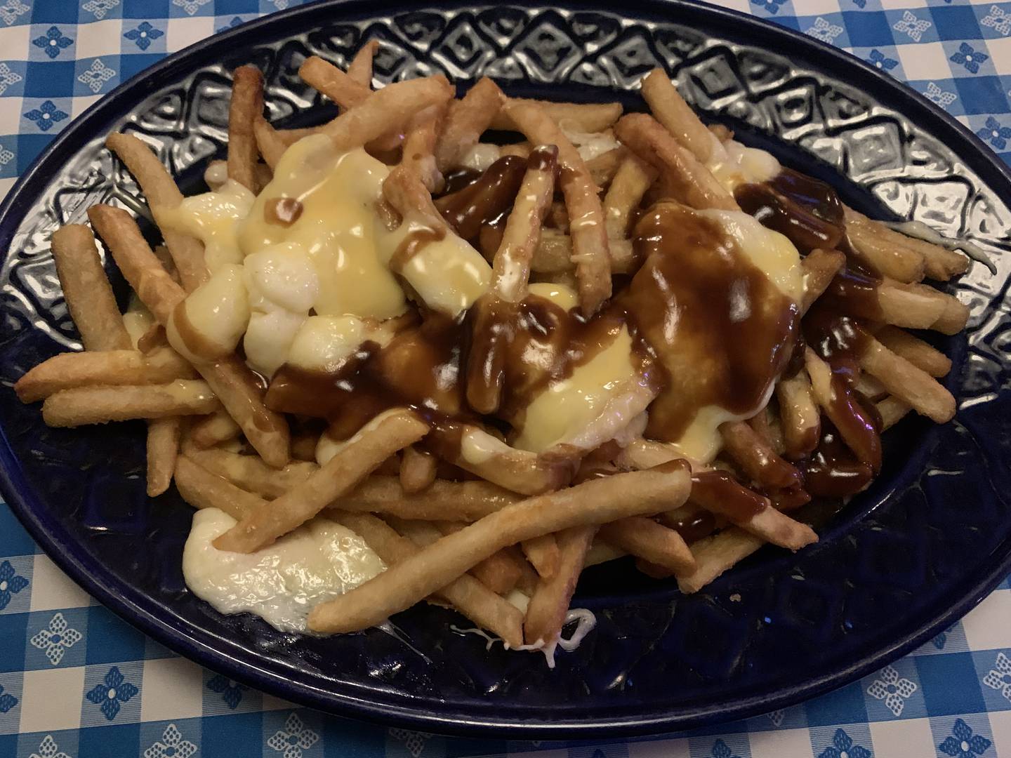 The Poutine at Cattleman's Burger snd Brew, beer battered french fries topped with melted cheese curds, brown gravy and a house-made four-cheese sauce.