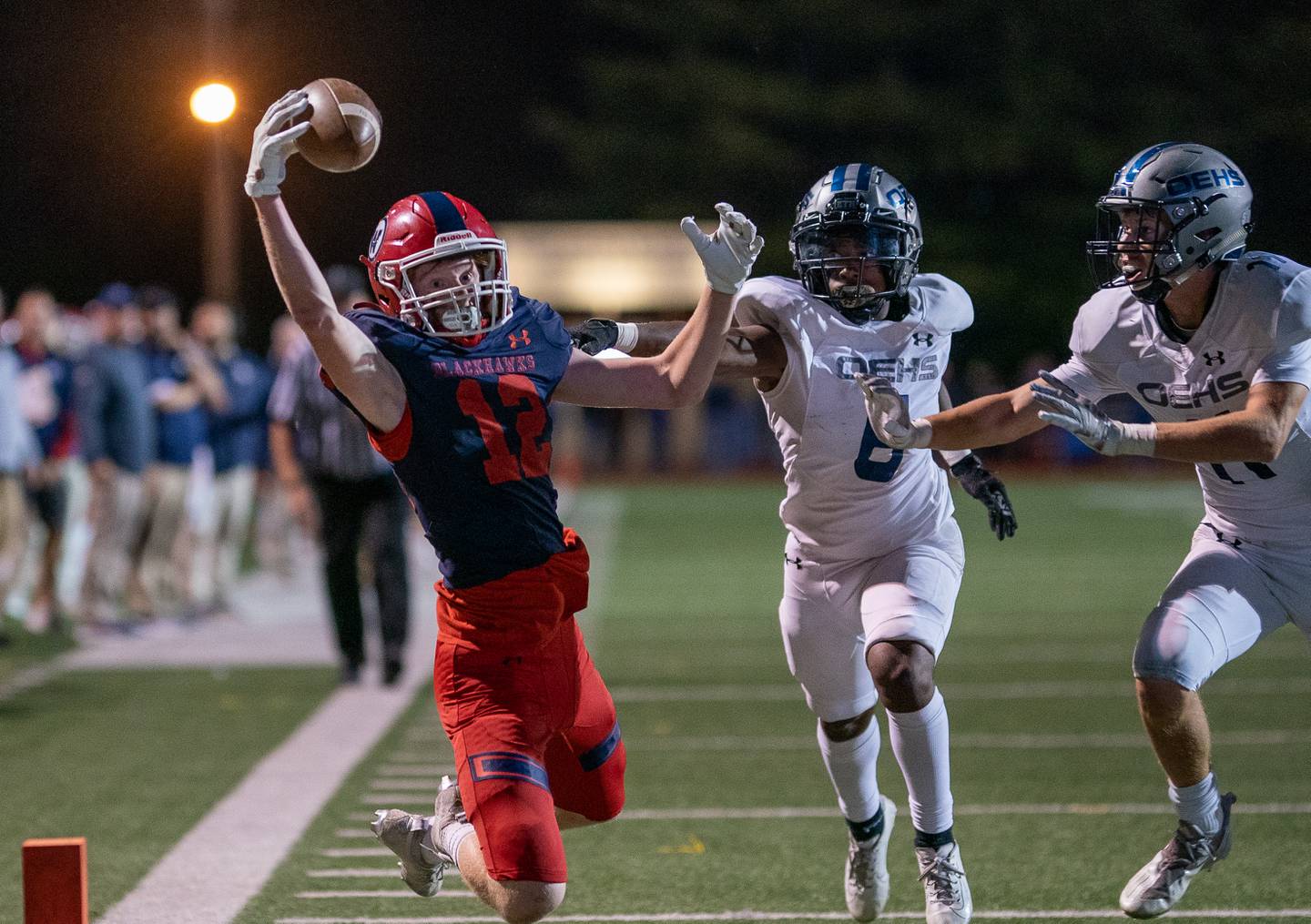 West Aurora's Andrew Kolich (12) makes a one handed grab for a score against Oswego East during a high school football game at West Aurora High School in Aurora on Friday, Sep 24, 2021.