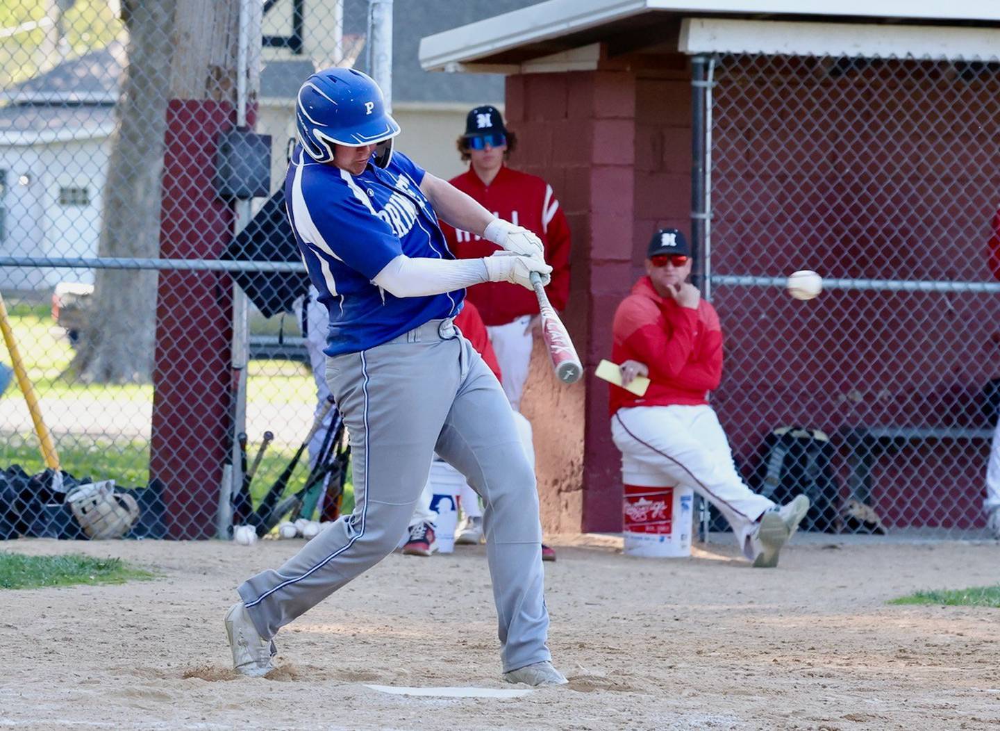Princeton's Jordan Reinhardt connects against Hall Thursday at Kirby Park in Spring Valley. Hall won 4-1.