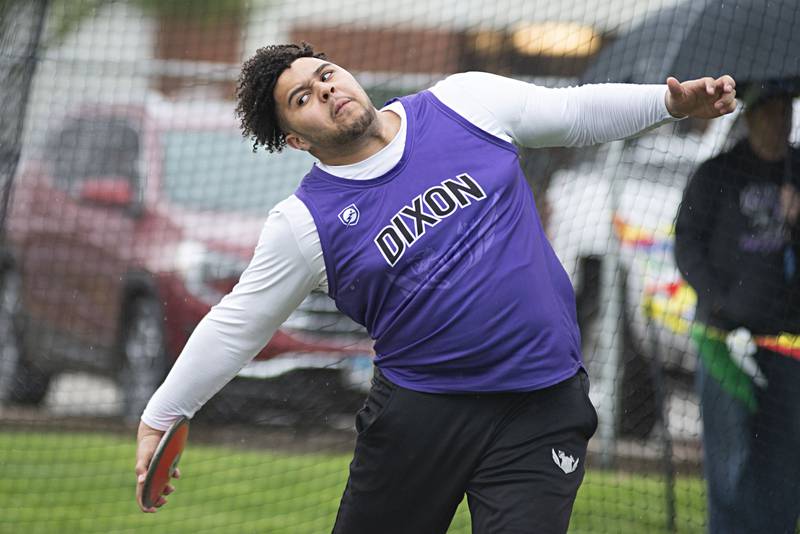 Dixon's Dre Jackson throws the disk Friday, April 29, 2022 at the Sterling Night Relays.