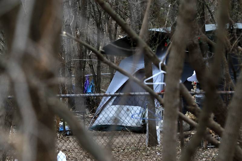 A tent at a homeless camp behind the Woodstock Shell gas station, 110 N. Eastwood Drive, on Tuesday, Dec. 10, 2024. A man suffered a serious chest wound on Monday in the area.