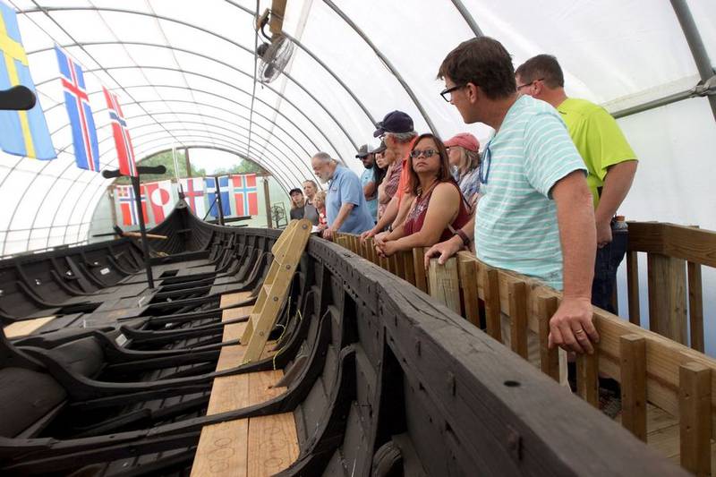 A group takes a tour of Geneva's Famous 1893 Viking Ship during the 113th Swedish Day Midsummer Festival at Good Templar Park in Geneva Sunday.