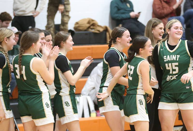 Members of the St. Bede Lady Bruin basketball team react ater winning the Tri-County Conference championship on Thursday, Jan. 23, 2025 at Roanoke-Benson High School.