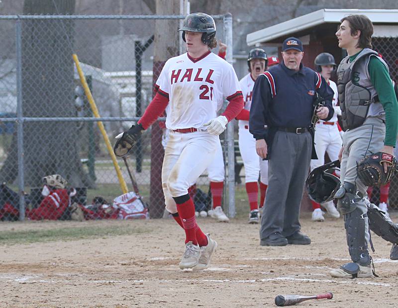 Hall's Mac Resetich scores the teams first run against St. Bede on Monday, March 27, 2023 at Kirby Park in Spring Valley.