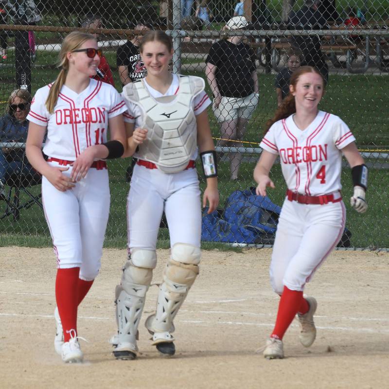 Oregon's Izzy Berg, Kendall Boyle, and Ashlee Mundell walk back to their dugout after beating Somonauk 6-0 at the 2A Oregon Regional on Wednesday, May 20, 2026.