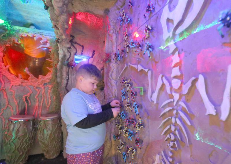Gabe Wujek of Lincoln School in Mendota, checks out That Kid Place Mobile Sensory Museum Jurassic Park trailer during the Wallace Warrior Games on Friday, May 8, 2026 at Wallace Grade School. The unified event promoted inclusiveness, friendships and fun. 25 schools and over 400 kids from La Salle, Bureau and Putnam Counties participated in the event.