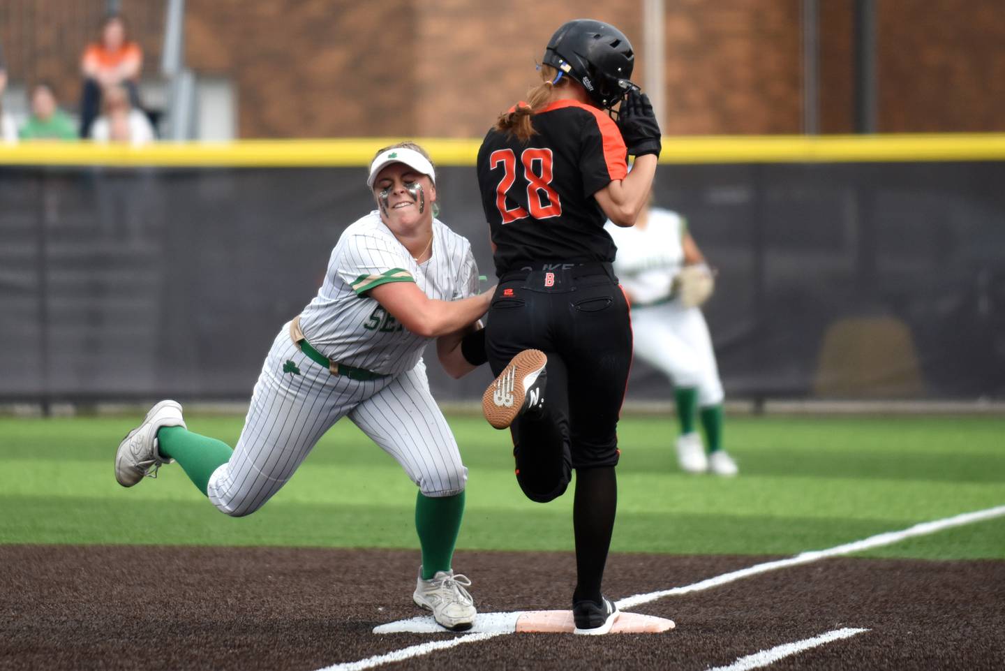 Seneca's Emma Mino, left, and Beecher's Ava Olson make contact as Mino forced Olson out at first base during the Class 2A Seneca Sectional championship Friday, May 30, 2025.
