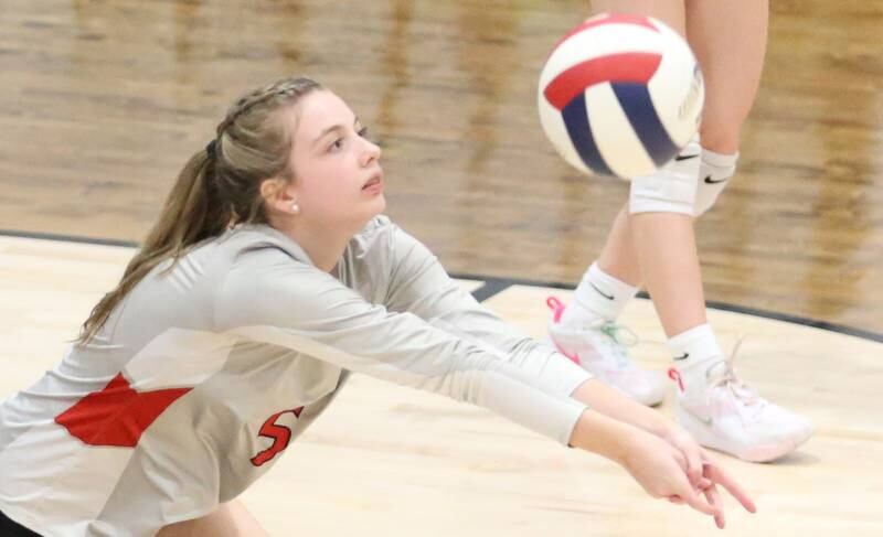 Woodland's Layna Wilcoxen returns a serve fron Earlville on Wednesday, Sept. 25, 2024 at Woodland High School.