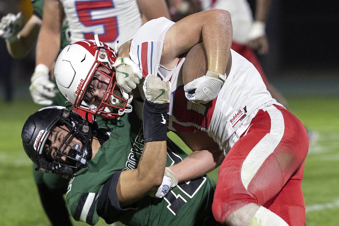 Oregon’s Keaton Salsbury is tackled by Rock Falls’ Austin Casteneda Friday, October 11, 2024, against Rock Falls.