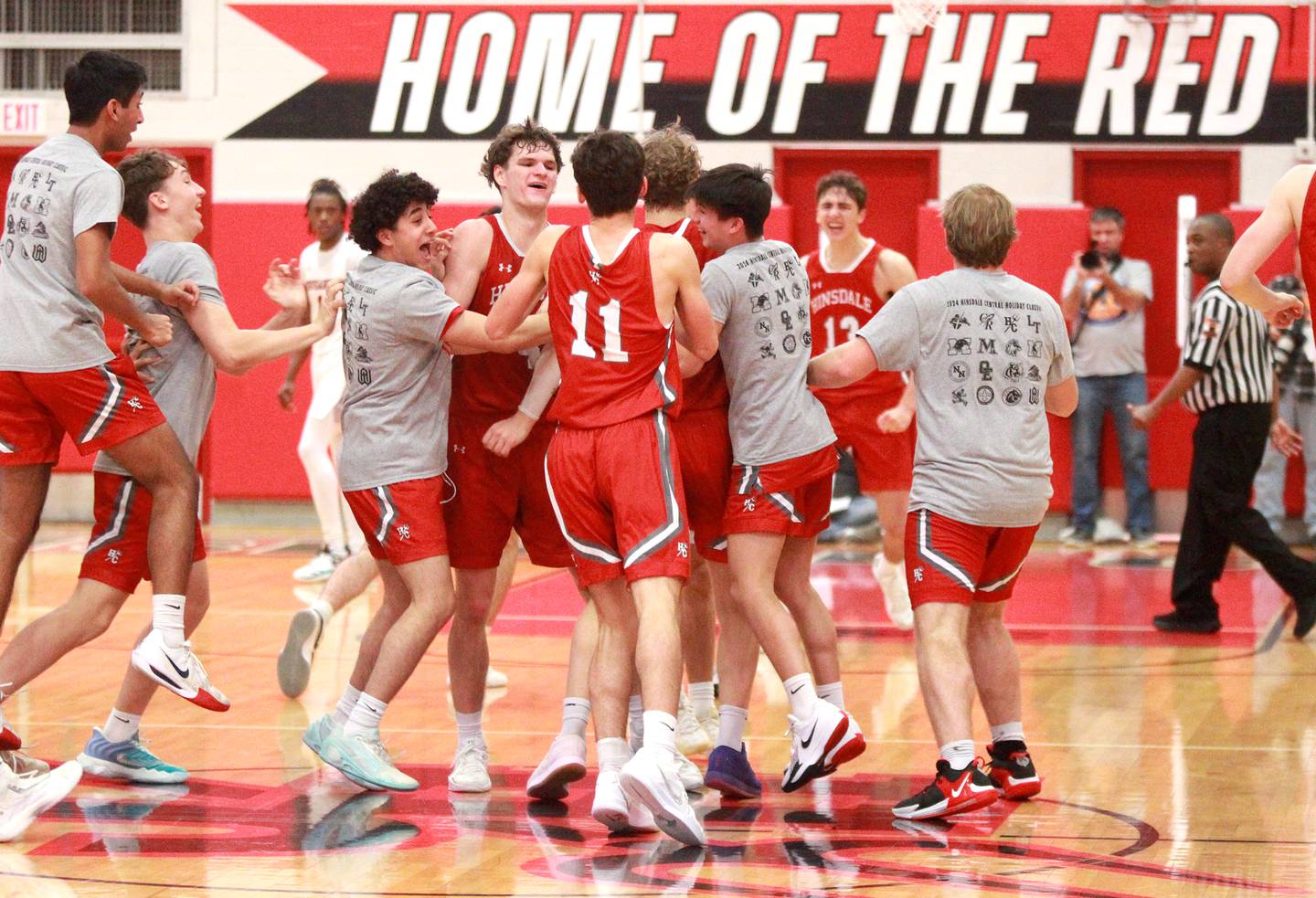 Hinsdale Central players celebrate their win over Brother Rice during the Hinsdale Holiday Classic championship game on Monday, Dec. 30, 2024 in Hinsdale.
