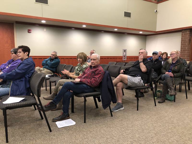 People listen to a speaker during a Huntley Village Board meeting April 25, 2024.