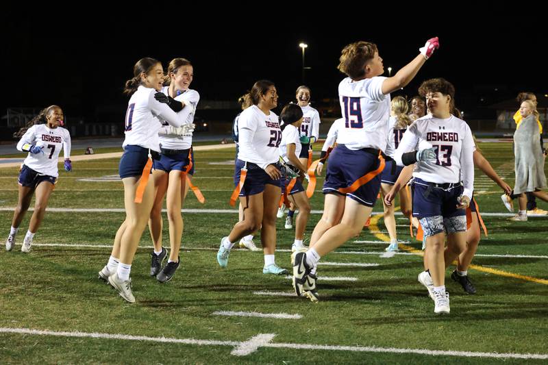 Oswego players celebrate their win following the Panthers' 13-7 victory over Joliet West on Tuesday, Oct. 7, 2025.