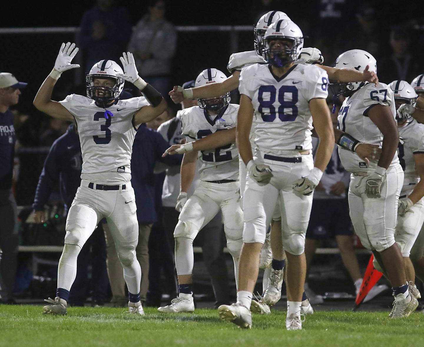 Cary-Grove's Preston Walsh celebrates with his teammates after they defeated Prairie Ridge in a Fox Valley Conference football game on Friday, Sept. 27, 2024, at Prairie Ridge High School.