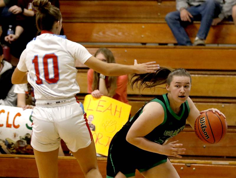 Alden-Hebron’s Rileigh Gaddini drives the baseline agains Marian Central's Adriana Wrzoss during the girl’s game of McHenry County Area All-Star Basketball Extravaganza on Sunday, April 13, 2025, at Alden-Hebron’s Tigard Gymnasium in Hebron.