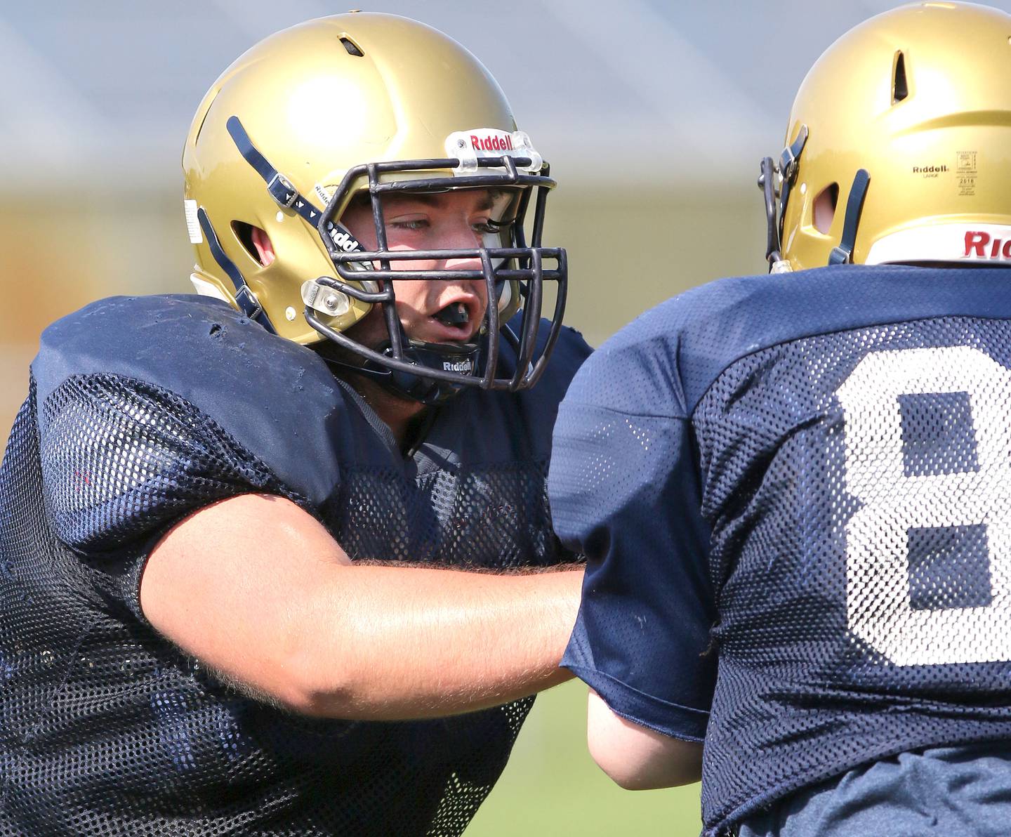 Hiawatha center Danny Fisher works on blocking during practice Monday, Aug. 16, 2021 at the school in Kirkland.