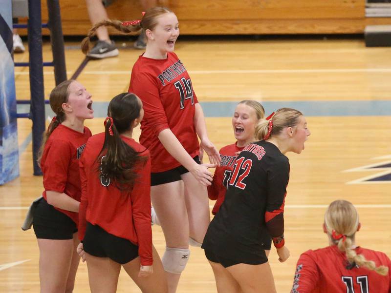 Members of the Erie-Prophetstown volleyball team react after defeating Seneca in the Class 2A Sectional semifinal game on Tuesday, Nov. 5, 2024 at Bureau Valley High School.