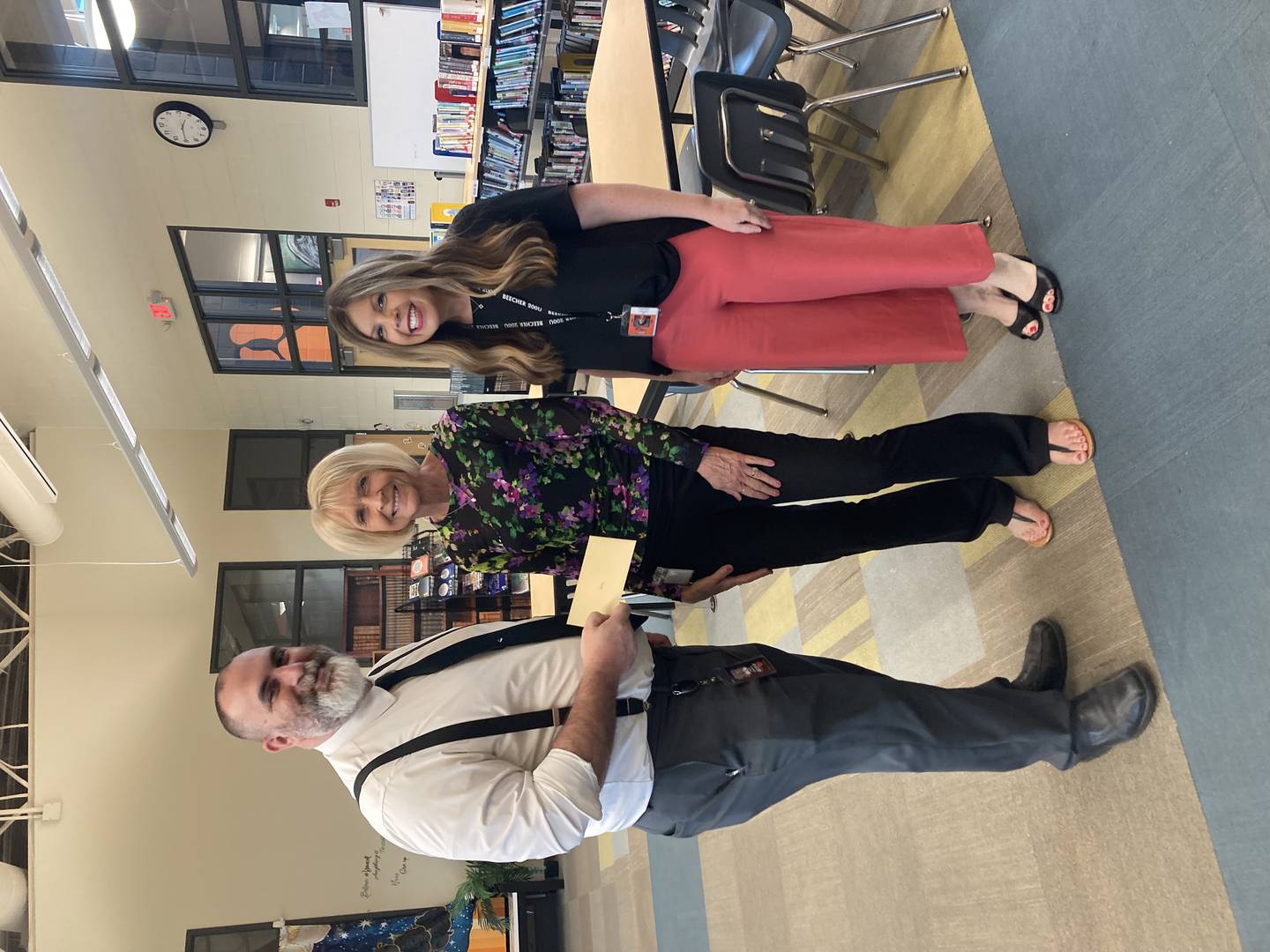 Beecher Superintendent Jack Gaham, retiree Tammy Wehling, and Beecher Junior High Principal Michelle Kwasny pose for a photo after the district recognized retirees and longtime staff members for their years of service at a May 2025 assembly.