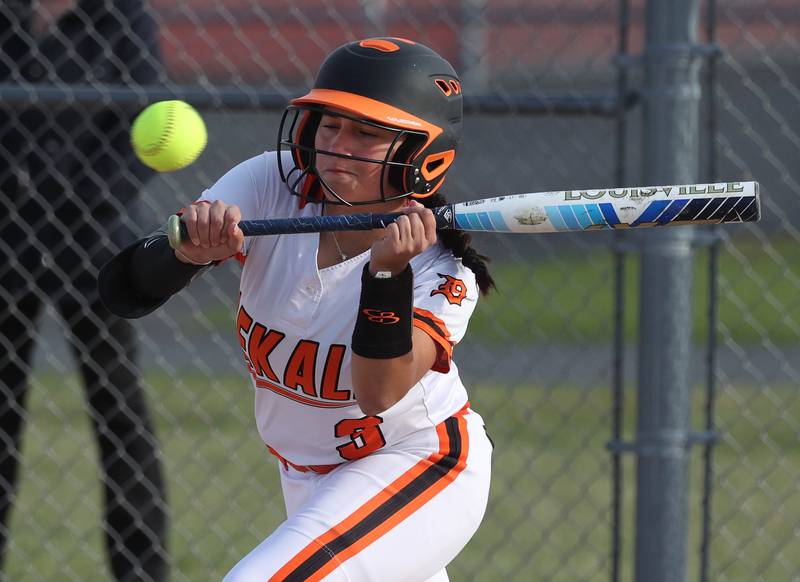 DeKalb's Emma Hart attempts a bunt Wednesday, April 16, 2025, during their game against Naperville Central at DeKalb High School.